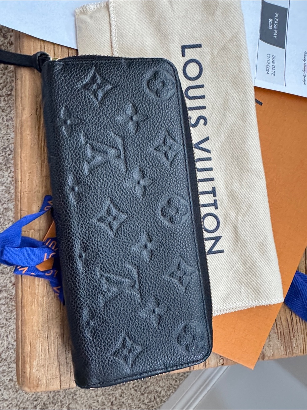 Louis Vuitton Black Empreinte Clemence Wallet.  Embossed Monogram with gold zip